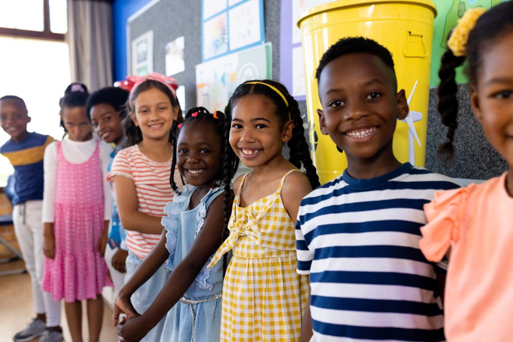 Portrait of happy diverse children in ecology class at elementary school. School, learning, childhood, ecology, recycling and education, unaltered.